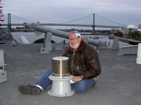 Head Brass Master reinstalling freshly polished Brass Periscope Cover on top of Turret #2  (October 27, 2001)